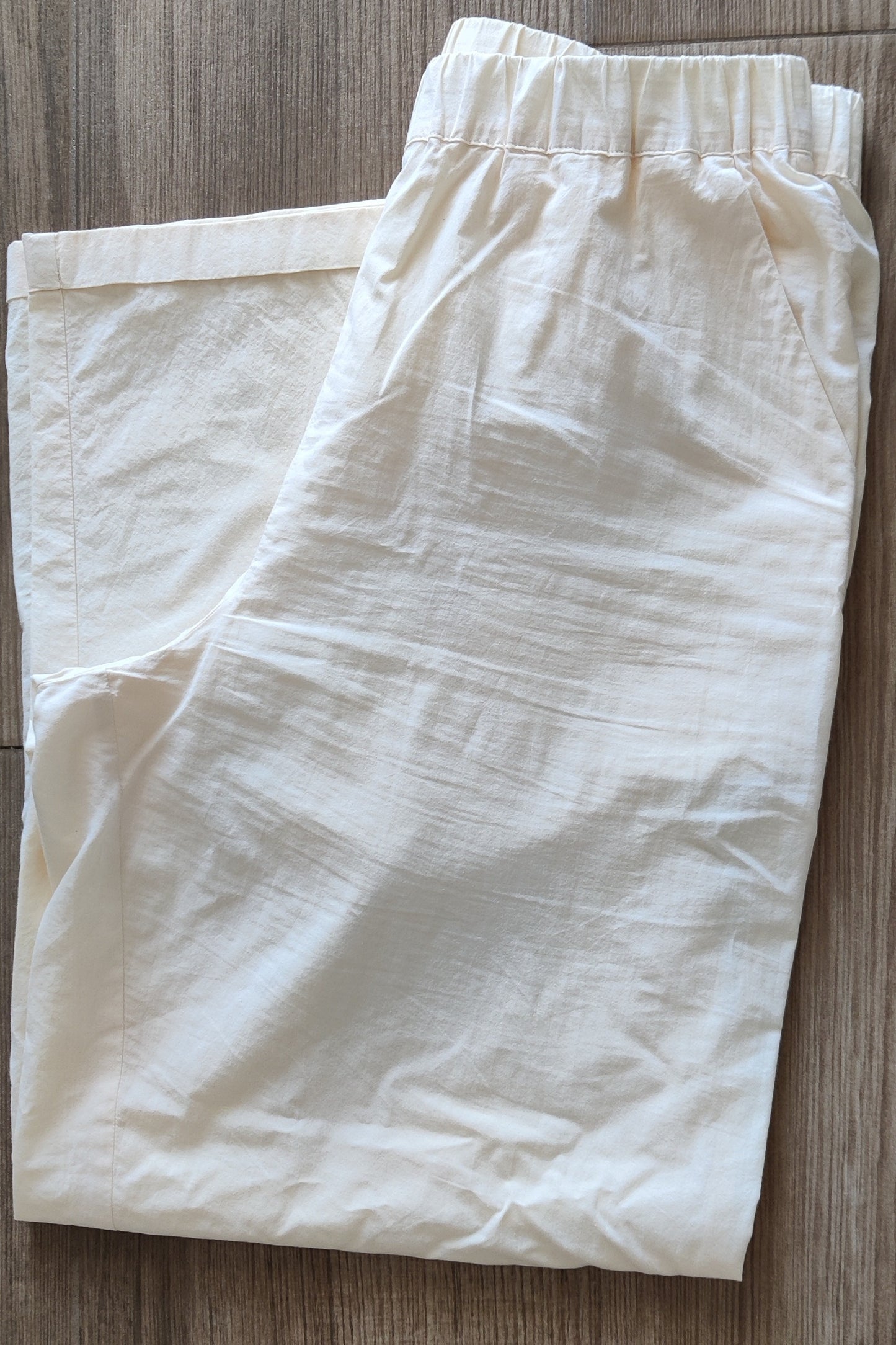 Lightweight cream-colored trousers