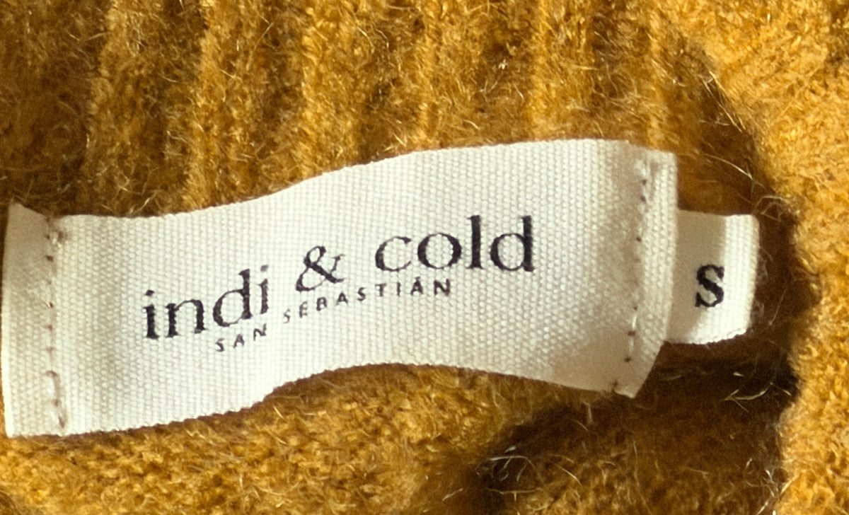 Mustard-colored turtleneck sweater