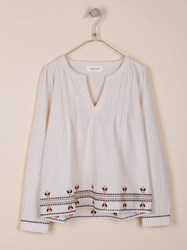 BLUSA CON BORDADOS EN CONTRASTE