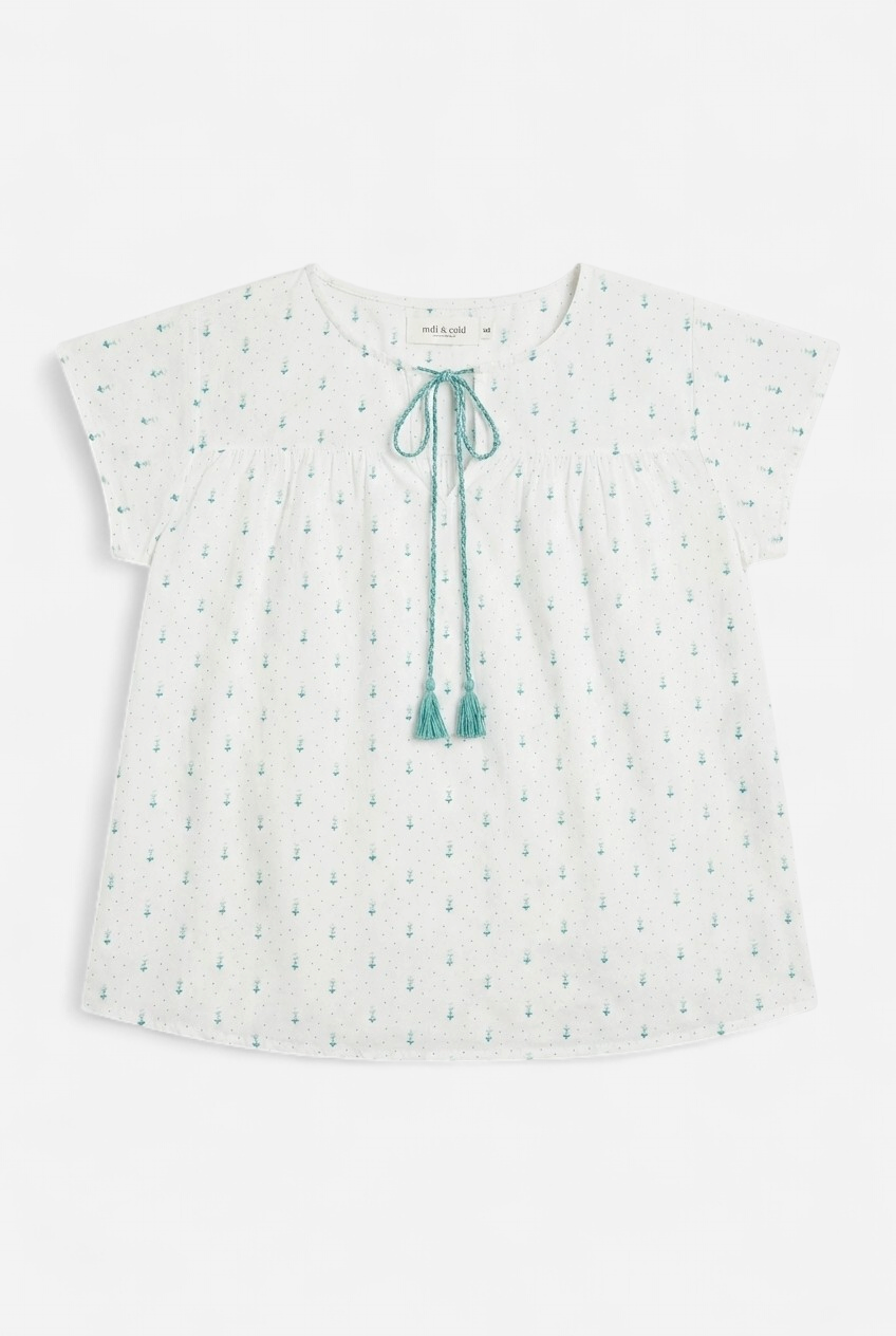 White short-sleeved blouse with green patterns