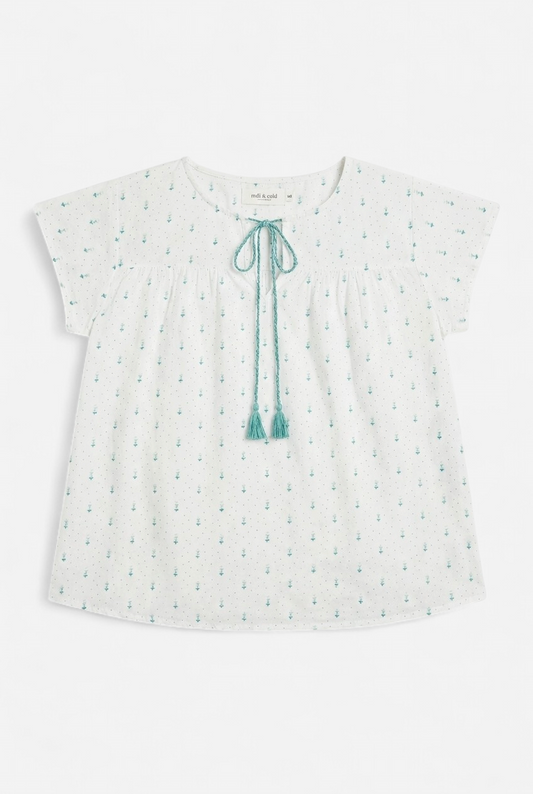 Blouse blanche à manches courtes avec motifs verts