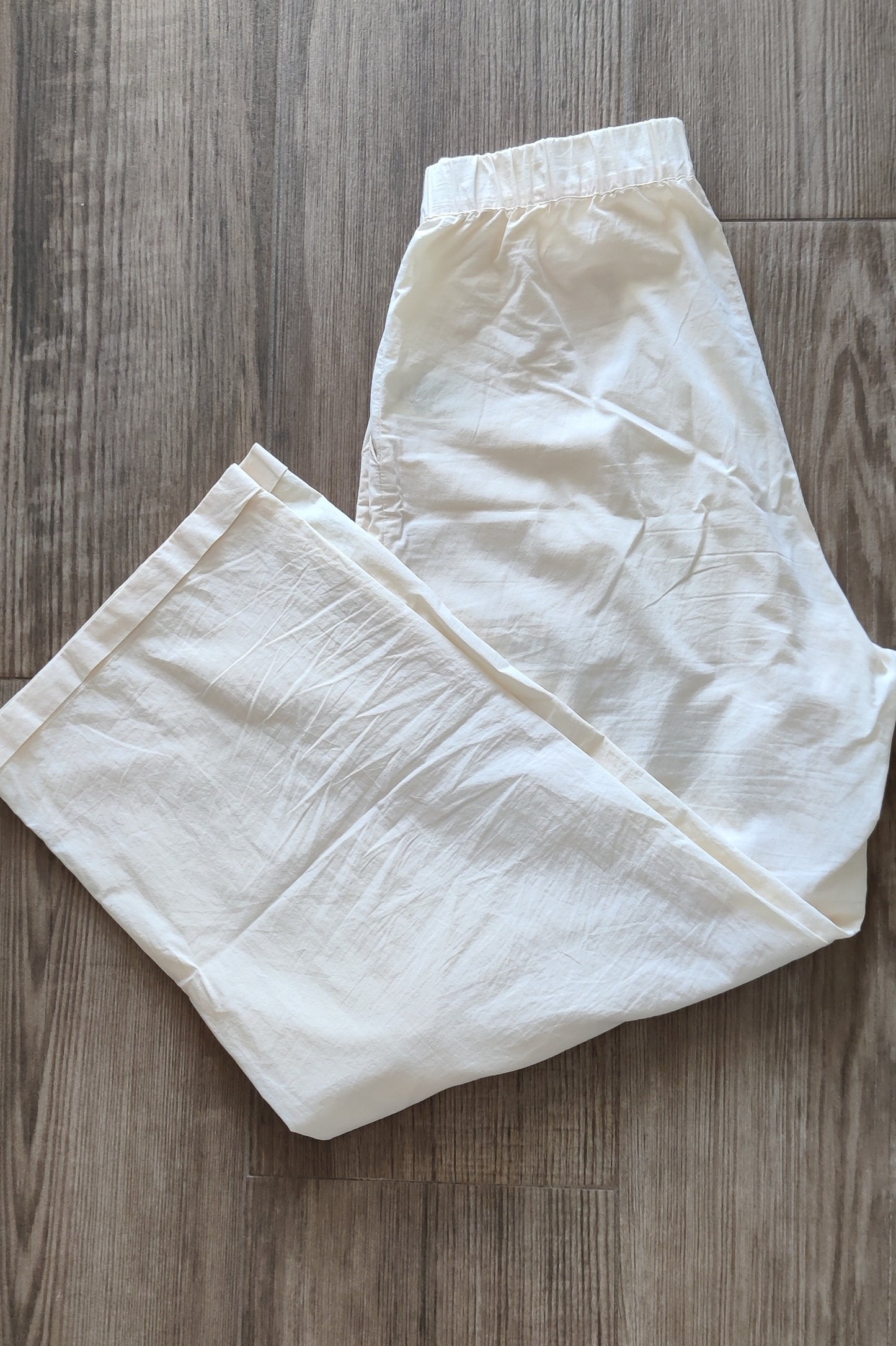 Lightweight cream-colored trousers