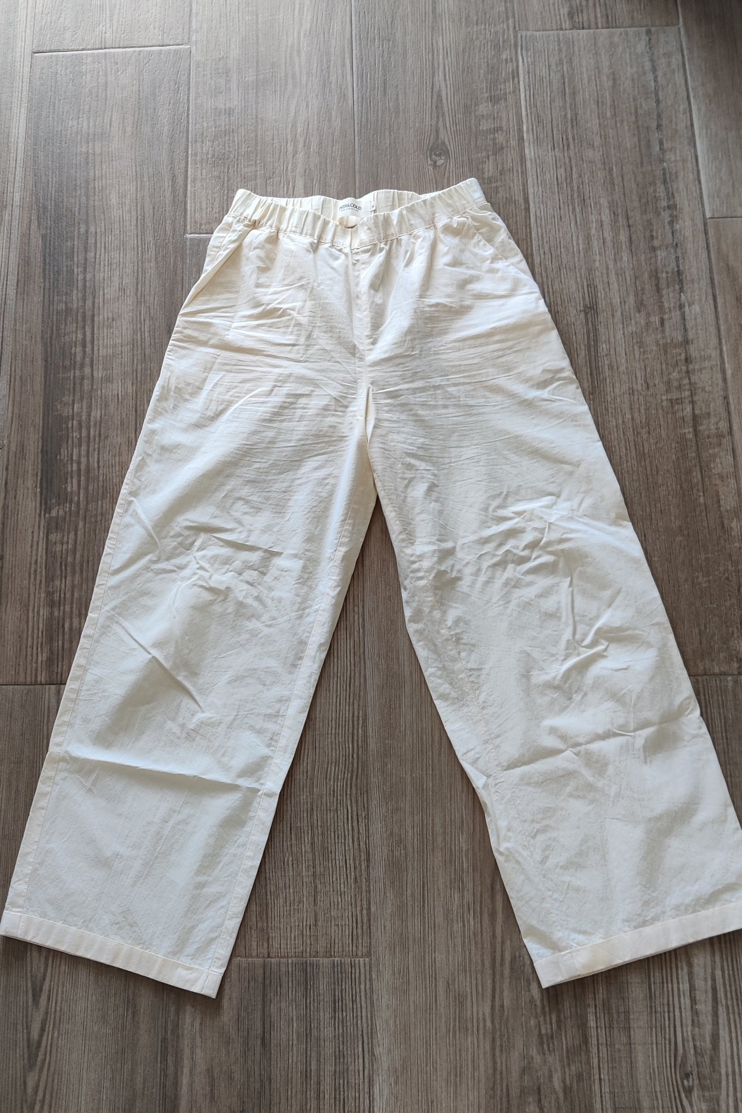 Lightweight cream-colored trousers
