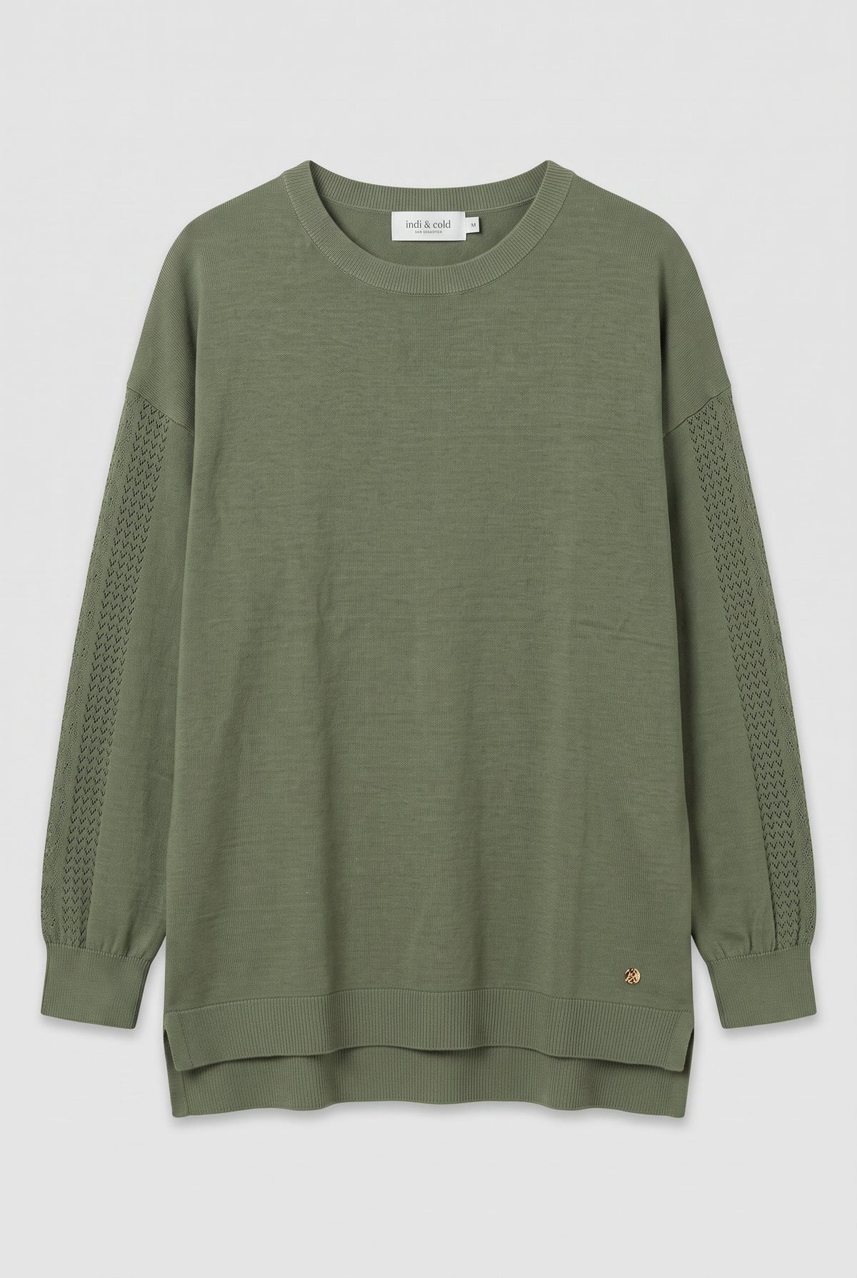 Green sweater with openwork detail on sleeves