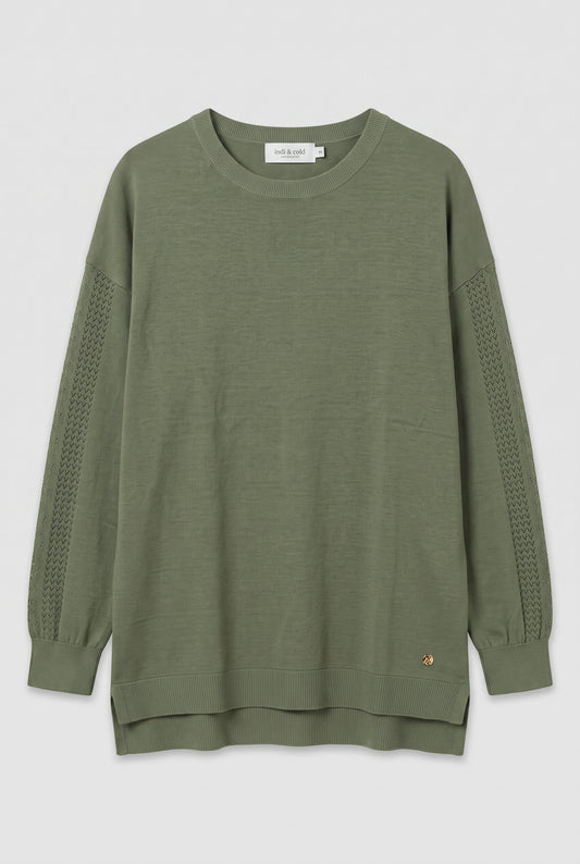 Pull vert avec détails ajourés aux manches