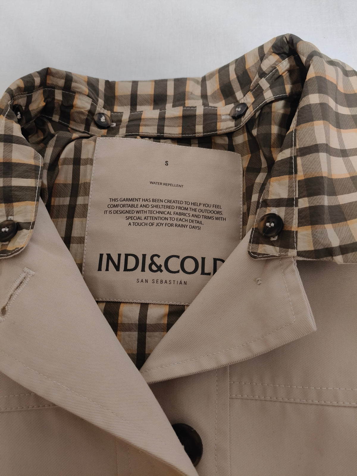 Oversized trench coat with checked lining