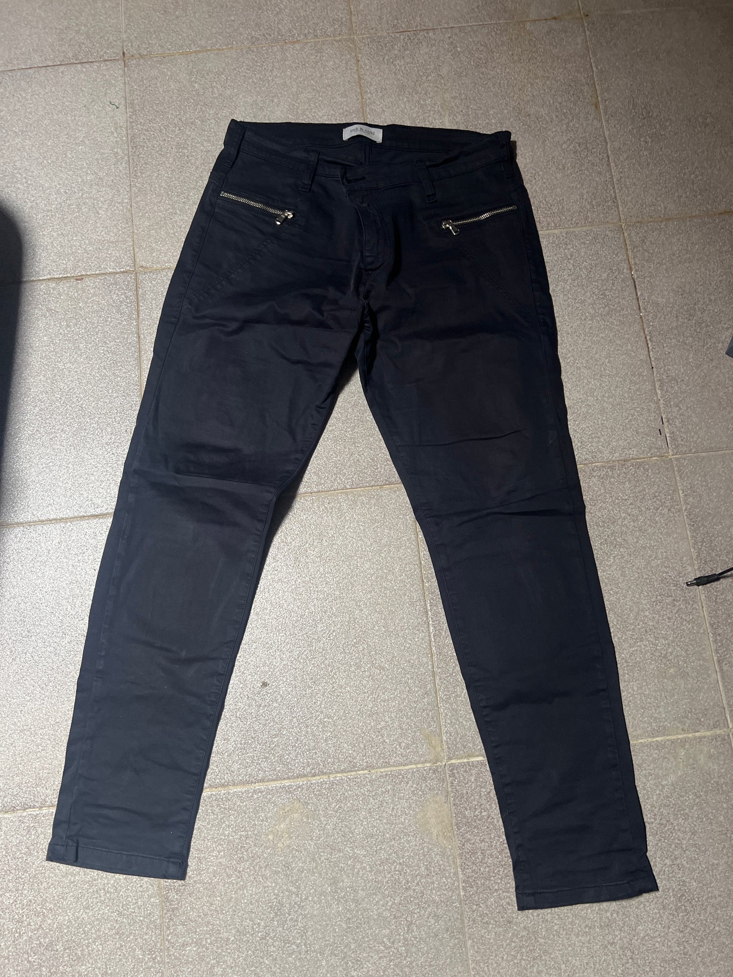 Blue trousers with zips