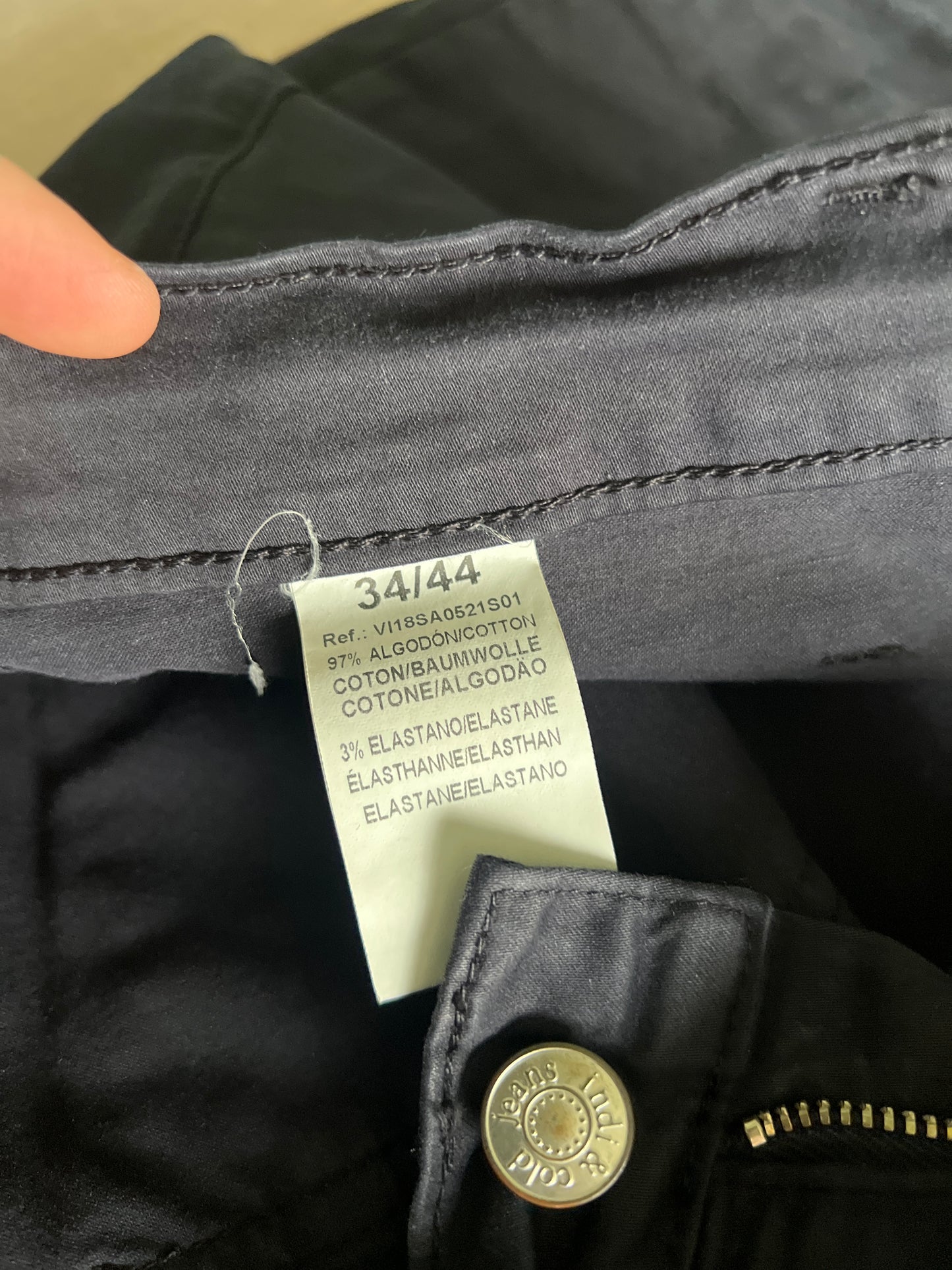 Blue trousers with zips