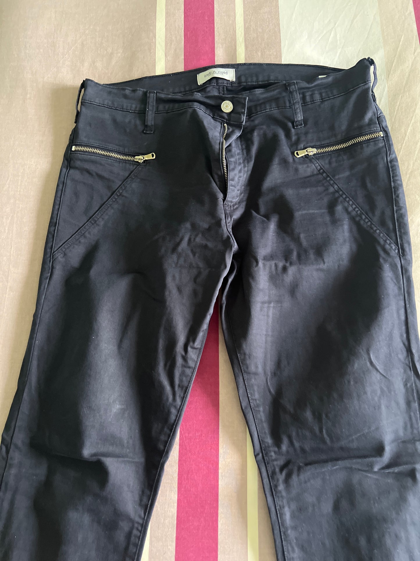 Blue trousers with zips