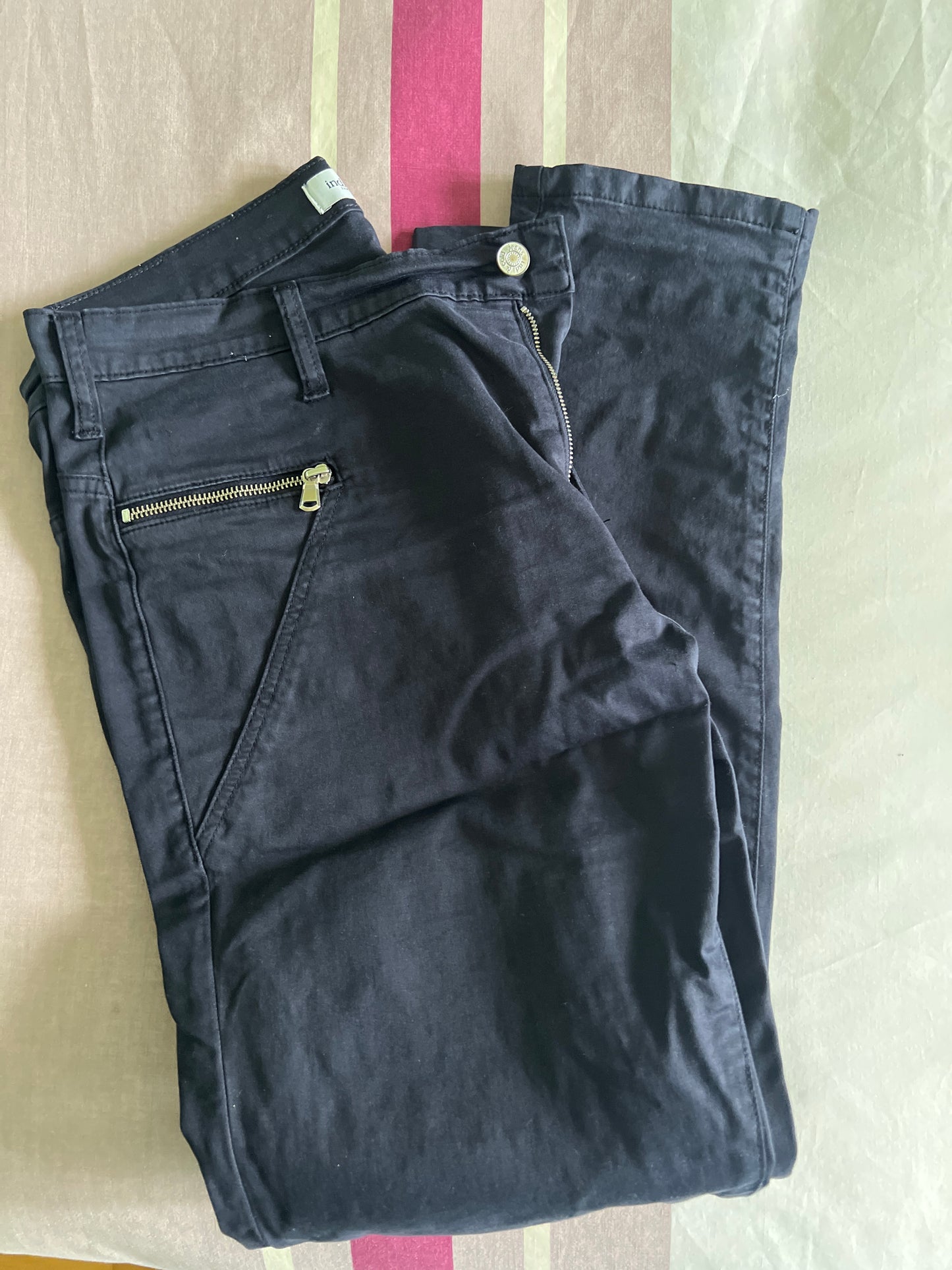 Blue trousers with zips