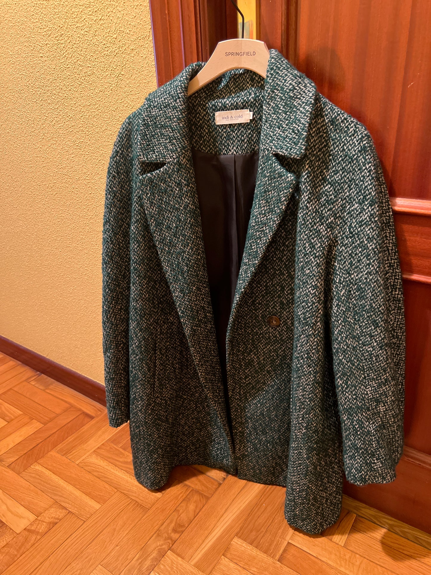 Speckled green coat
